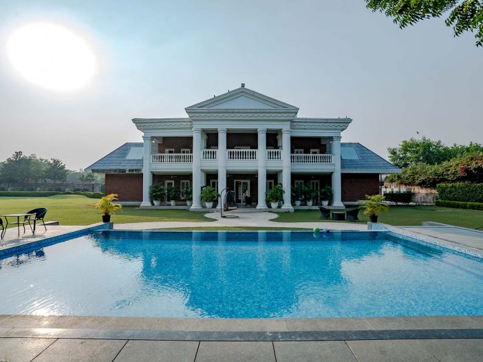 Backyard poolside view of the Safe House Wellness Retreat India