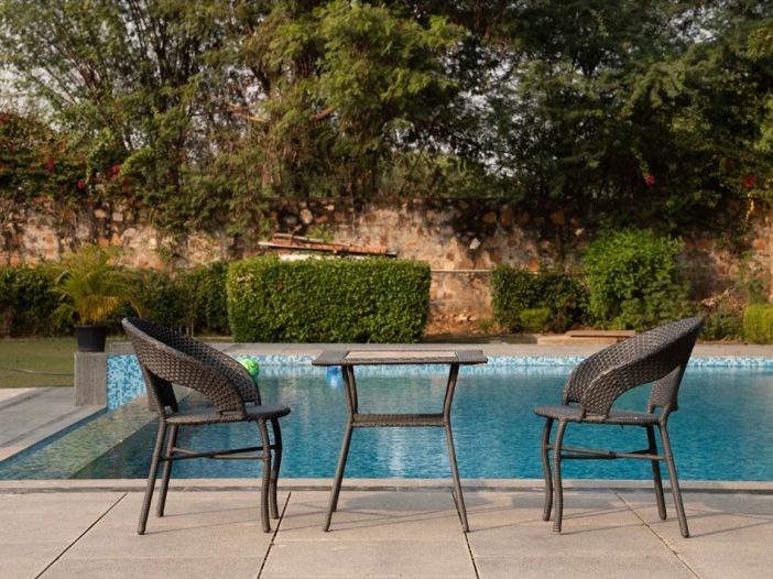 Poolside table and chairs at the Safe House