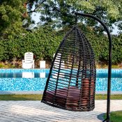 Wicker hanging chair outside of the Safe House Wellness Retreat India